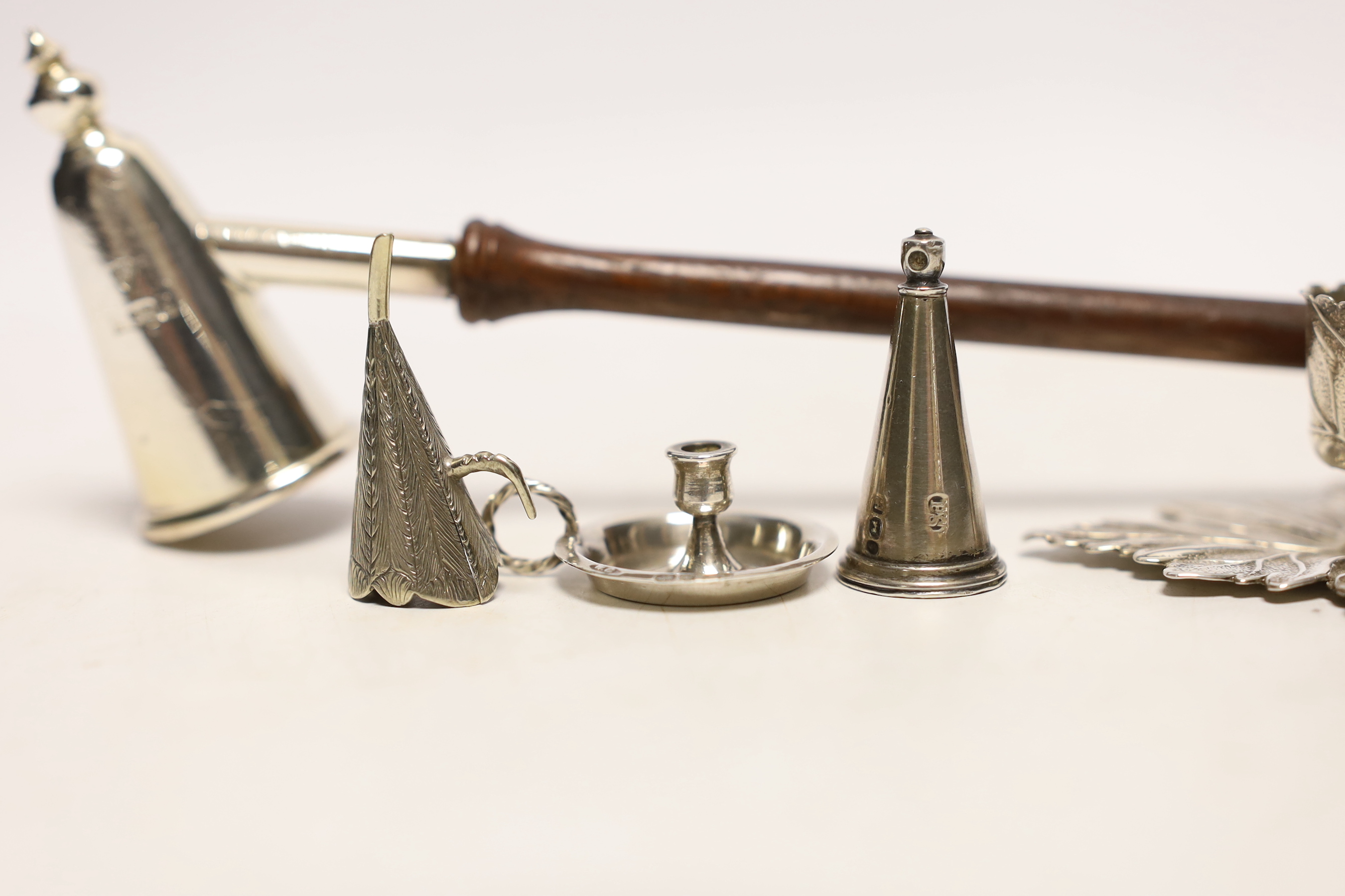 A George IV silver chamberstick, of leaf form, Birmingham, 1829, with associated unmarked extinguisher, together with a late Victorian miniature silver chamberstick, by William Comyns, retailed by Child & Child, a modern